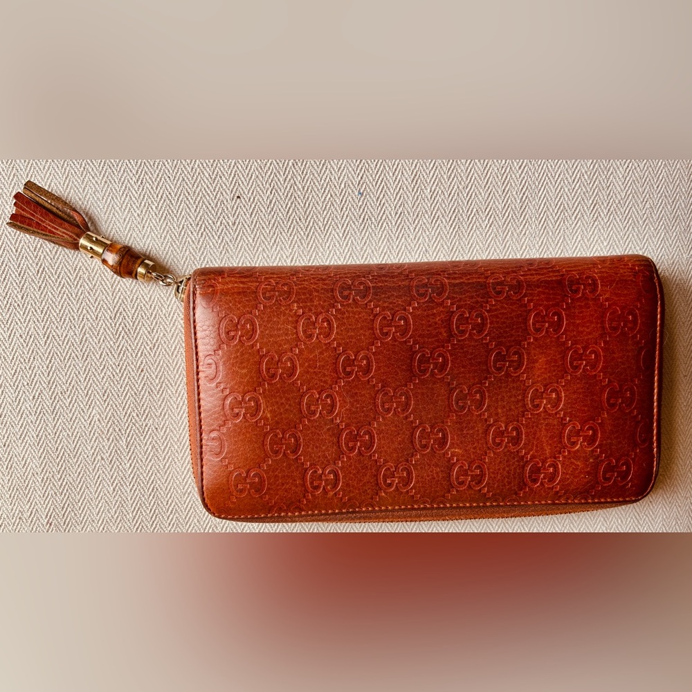 Gucci clutch wallet with tassel